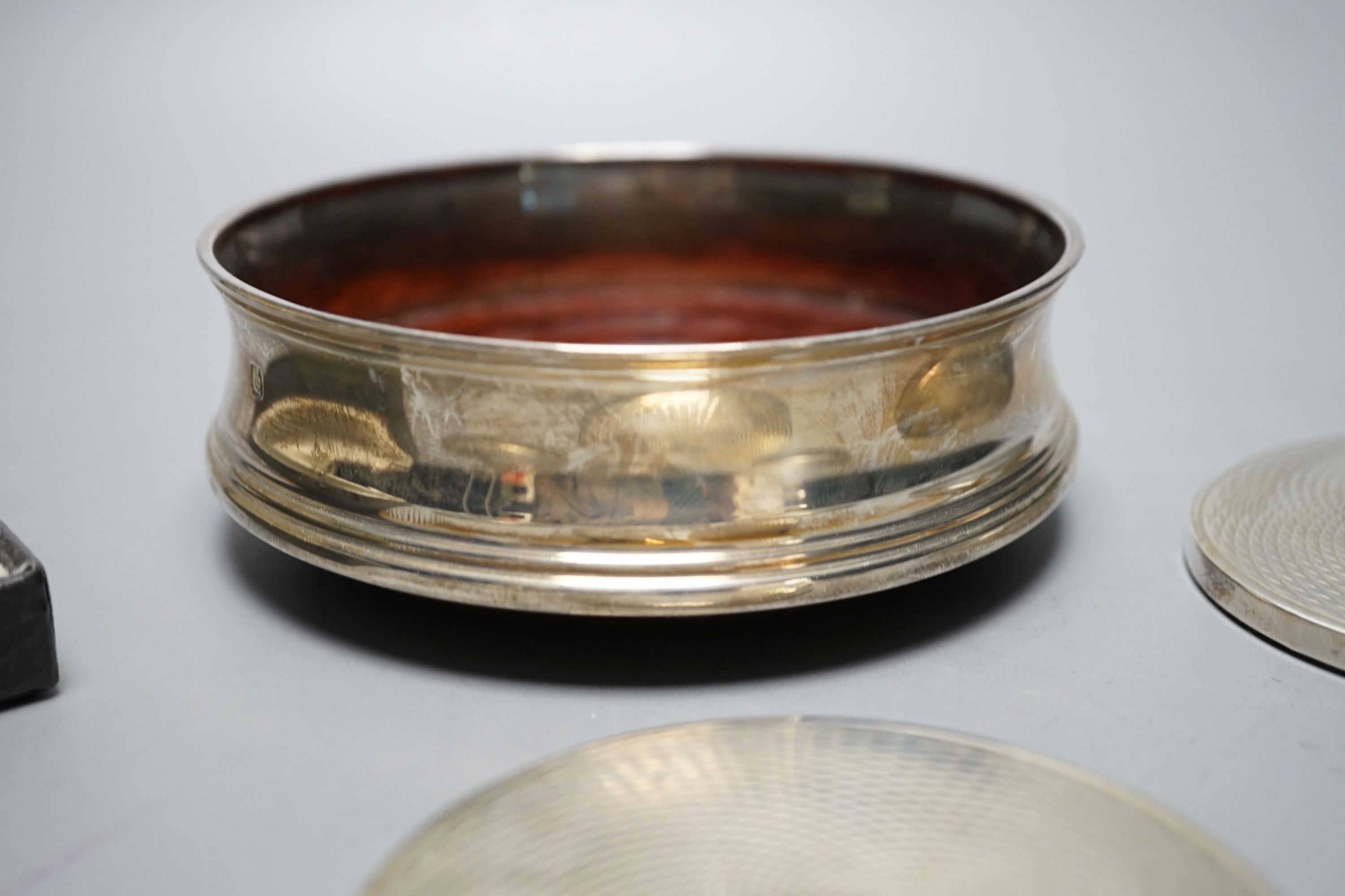 A cased set of six German 800 standard teaspoons by Robbe & Berking, a set of six silver mounted glass coaster and a modern silver mounted wine coaster.